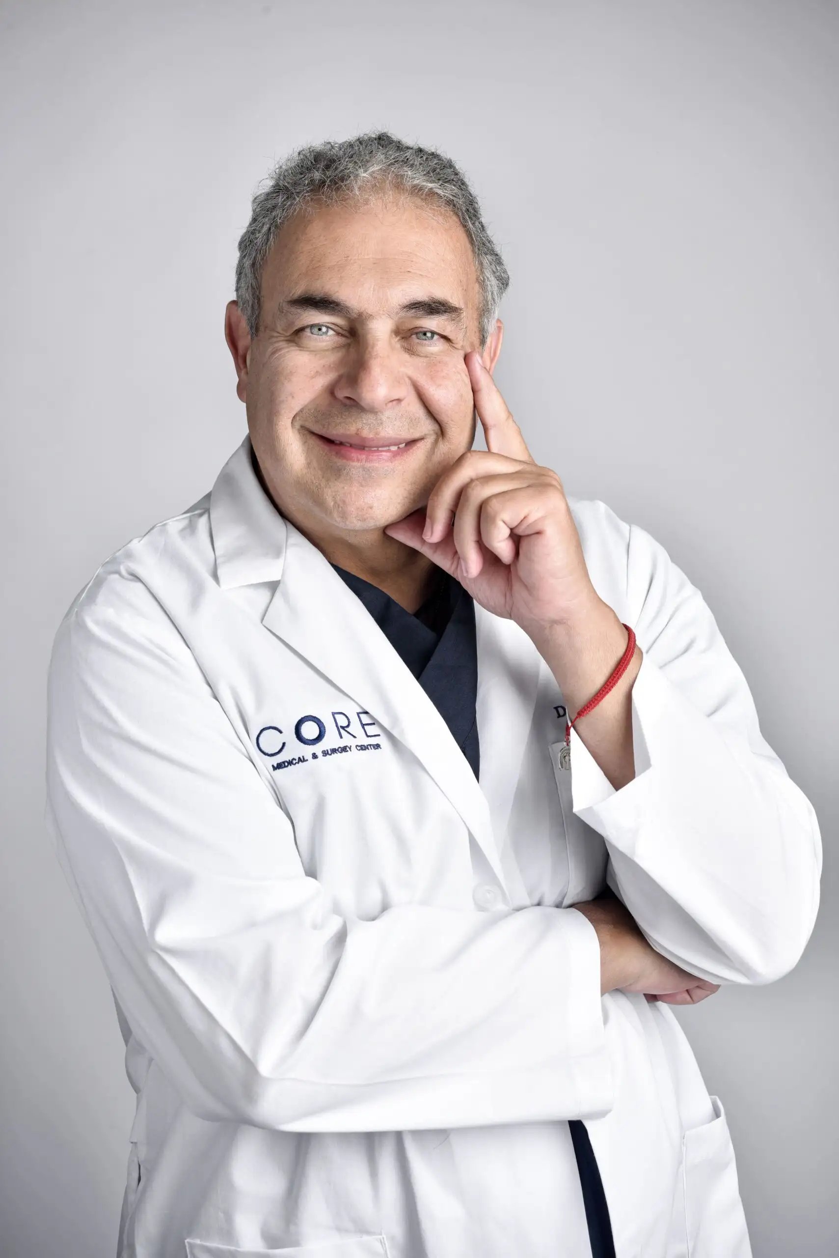 Hip Replacement in Tijuana, Mexico 17 Dr. Nicolas Zarur, recognized as a best knee replacement surgeon in Tijuana, smiling in his medical coat at CORE Medical & Surgery Center.