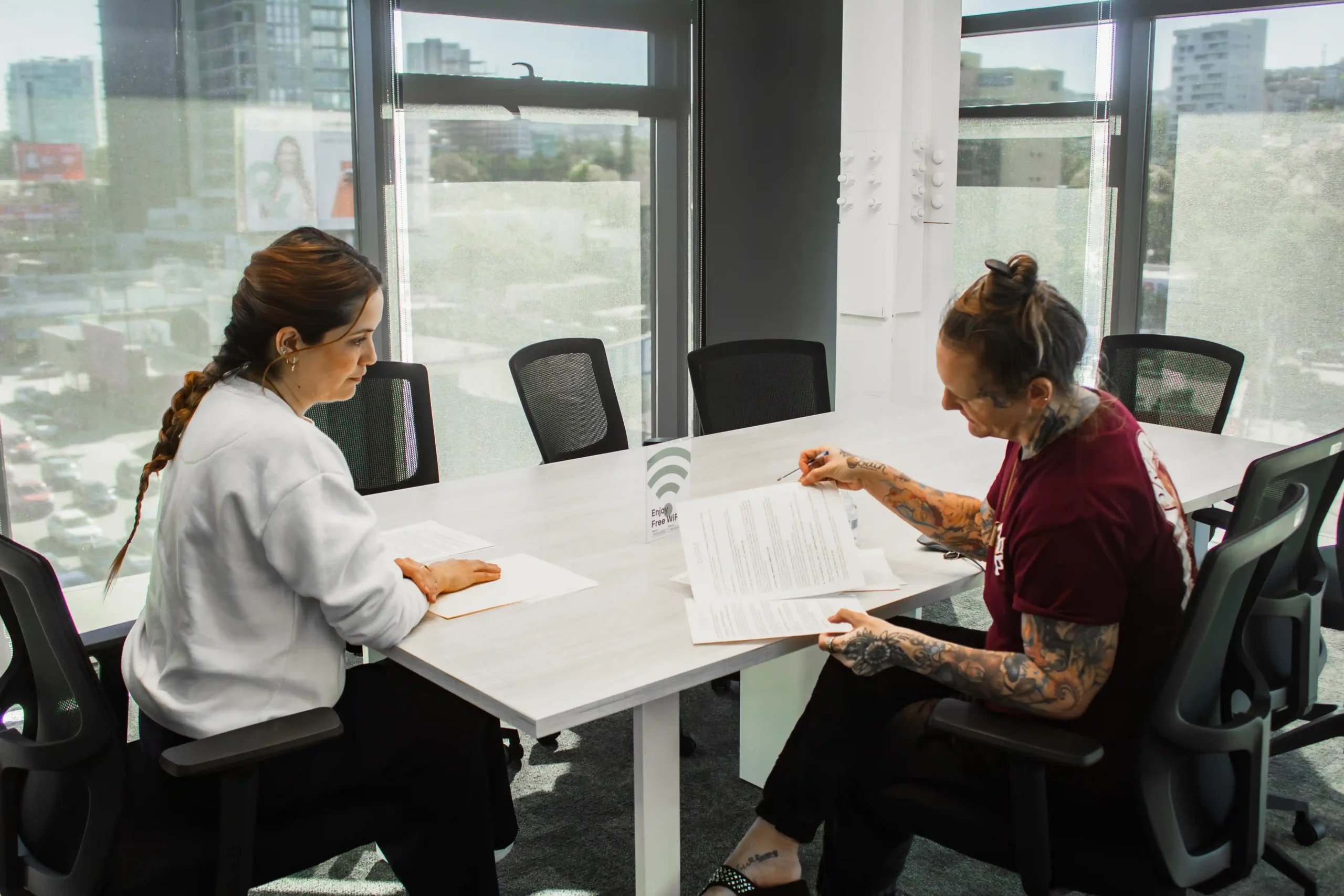 Medical Tourism in Mexico 11 A medical coordinator and an American patient reviewing surgical documents in a modern office, highlighting how to do medical tourism the right way in Tijuana.