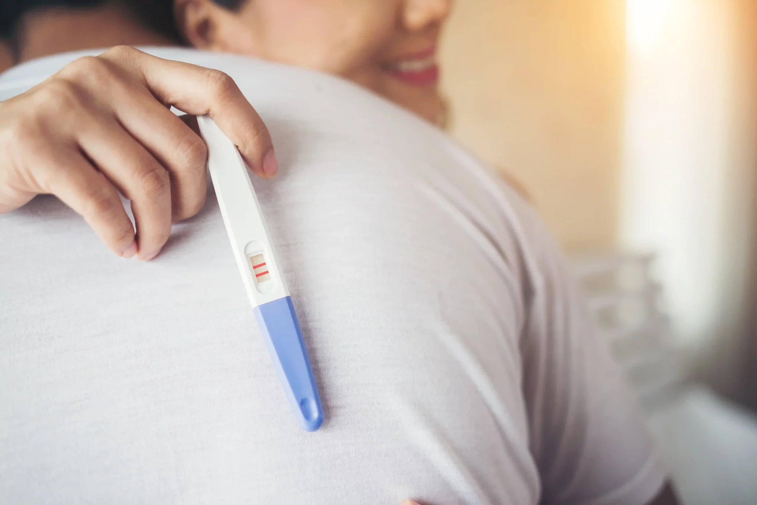 Fertility Clinics in Tijuana, Mexico 12 A happy couple hugging after a positive pregnancy test, representing the high success rates of fertility clinics in Tijuana and affordable IVF in Tijuana.