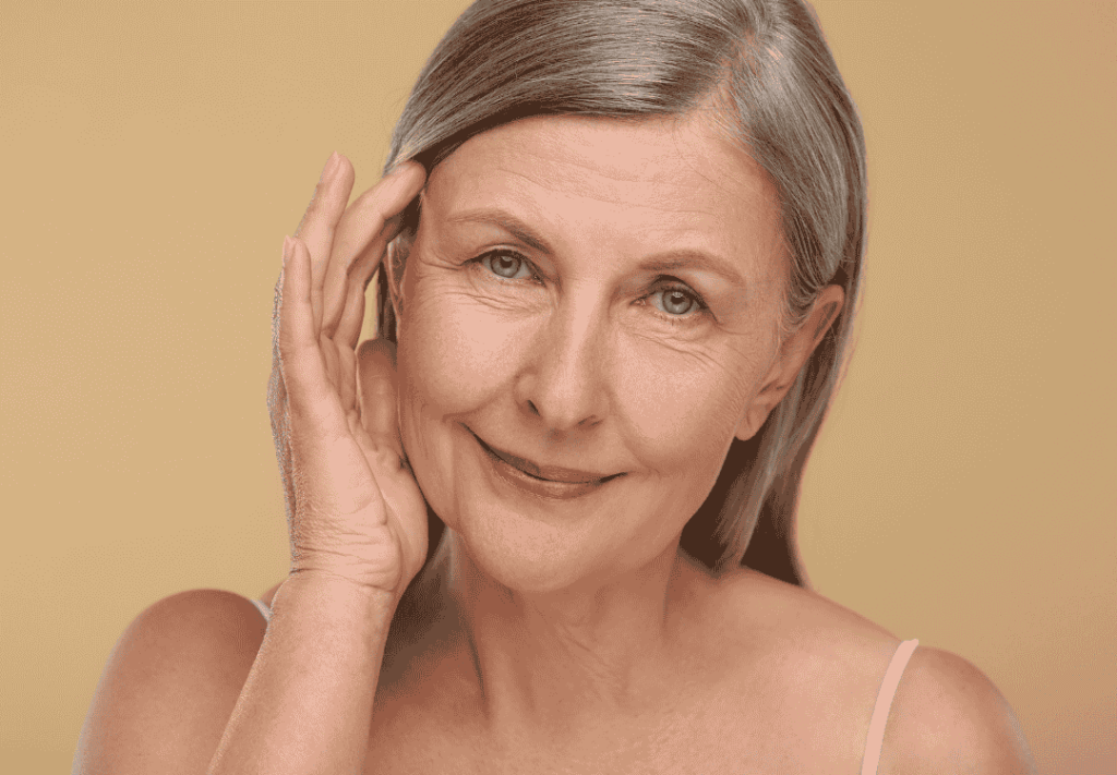 Smiling mature woman with smooth skin, representing the rejuvenating effects of facelift in Tijuana, Mexico