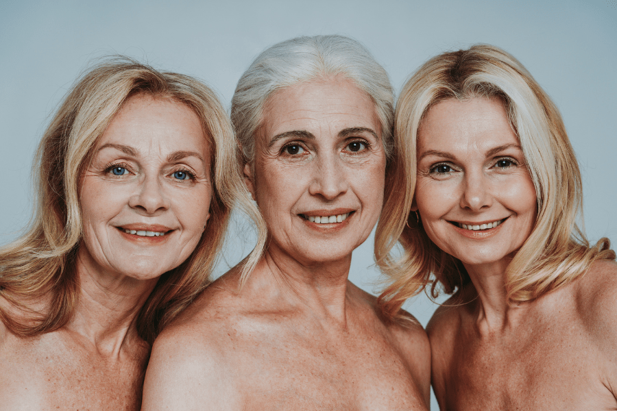 Smiling mature women representing beauty and confidence—exploring plastic surgery options for a youthful appearance.