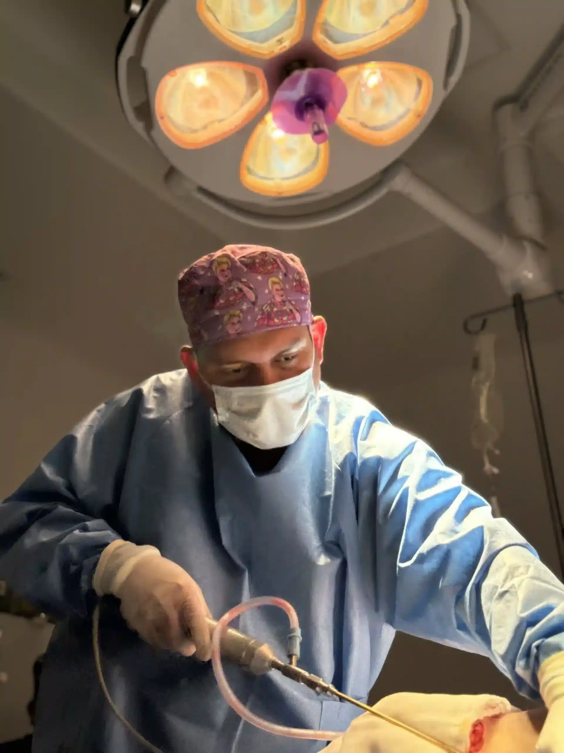 Skin Removal in Tijuana, Mexico 12 Certified plastic surgeon in Tijuana performing a Skin Removal procedure with specialized instruments, highlighting medical tourism safety and expertise.