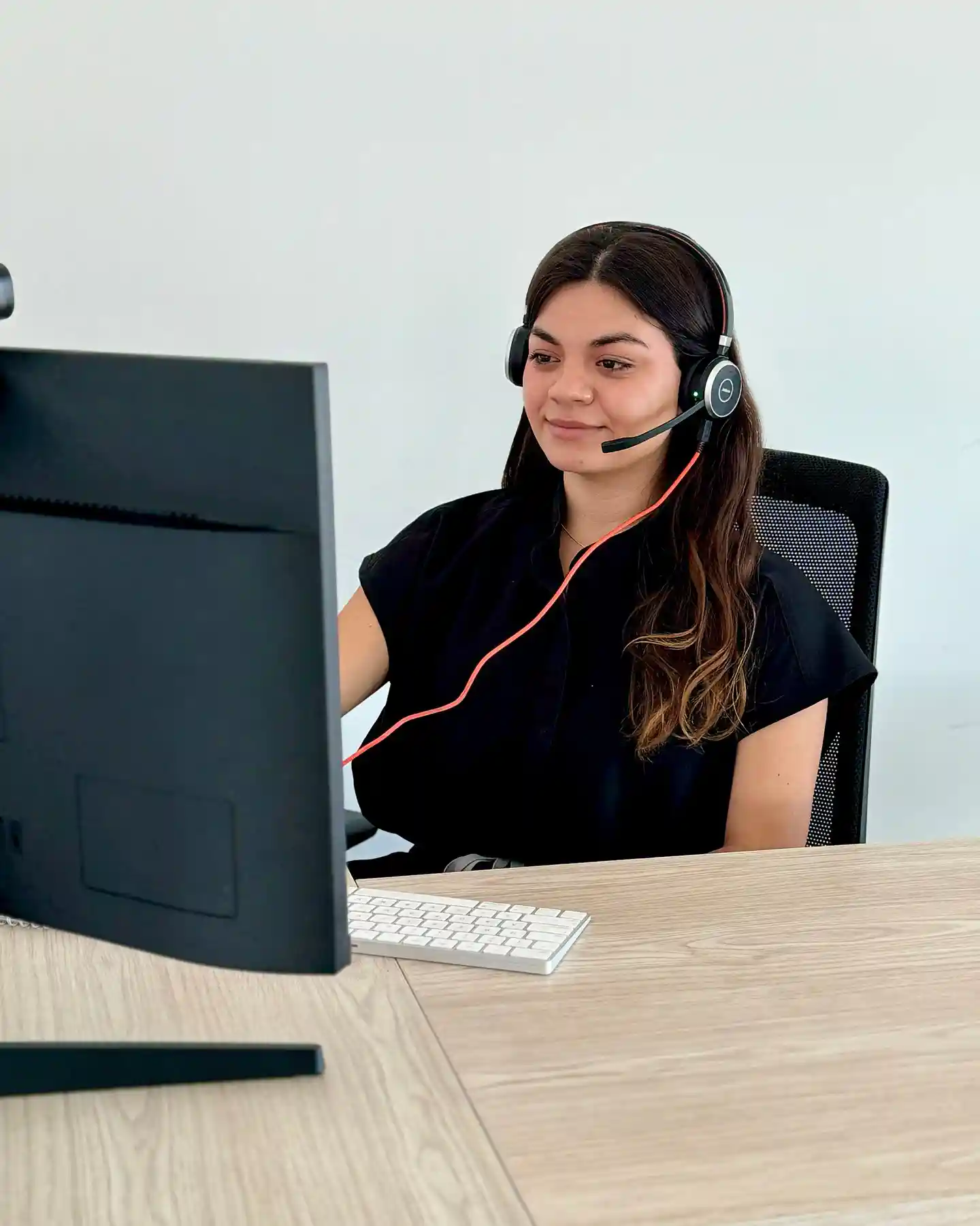 Medical Questionnaire 2 Friendly gastric sleeve surgery coordinator providing personalized support via headset to a patient planning weight-loss surgery in Tijuana.
