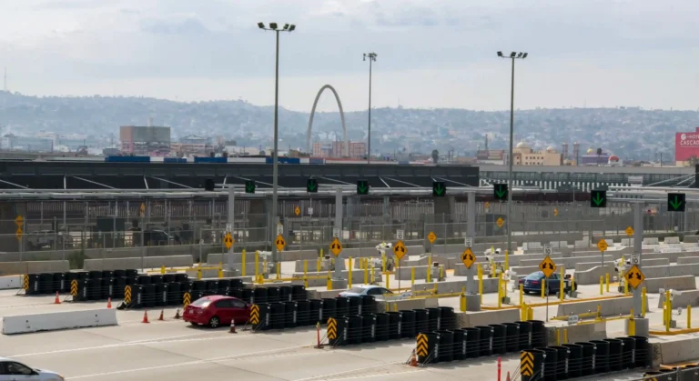View of the San Ysidro border crossing into Tijuana with the iconic Arch, illustrating the short travel route for plastic surgery in Tijuana patients from San Diego.