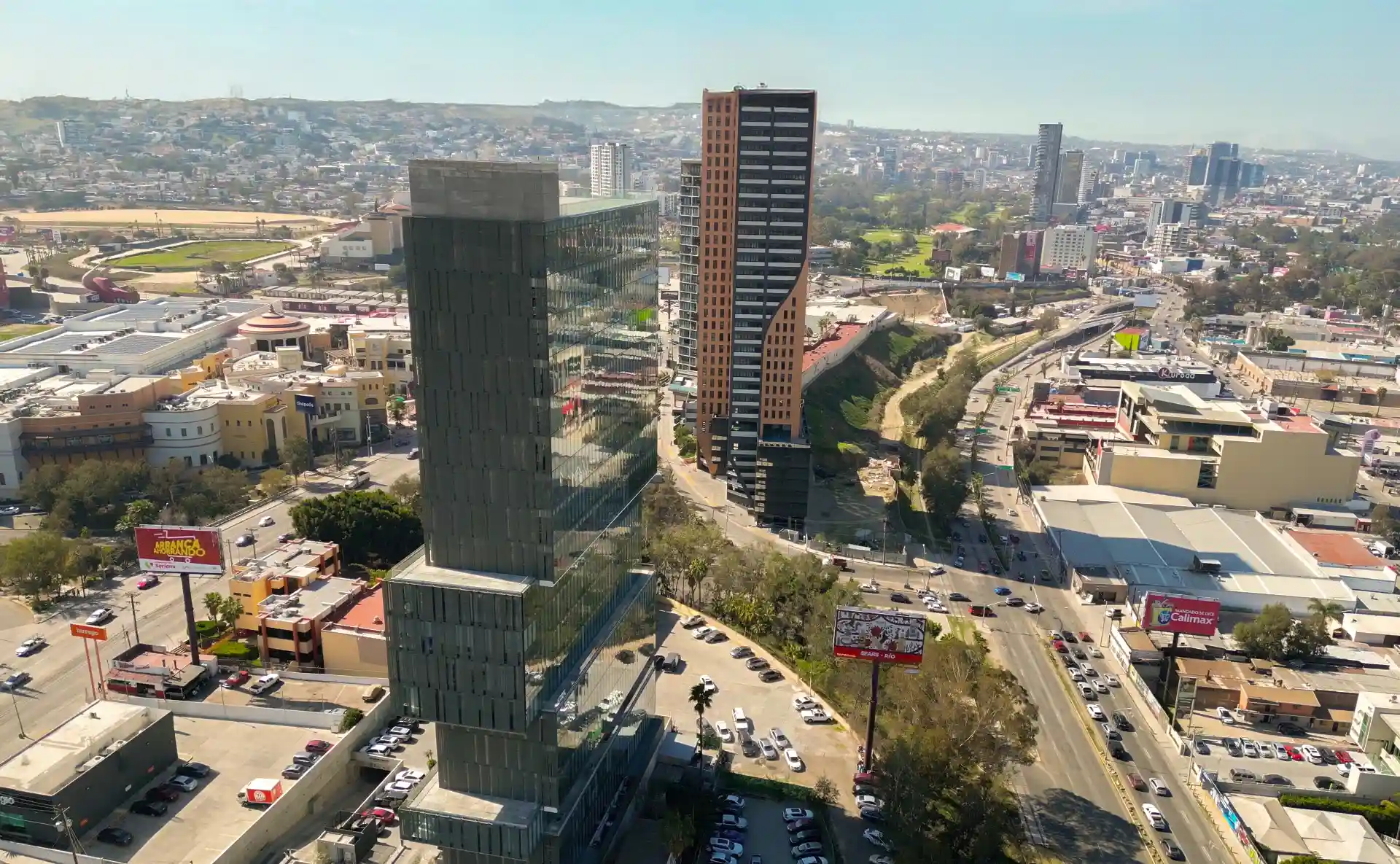 Skin Removal in Tijuana, Mexico 11 Aerial view of the business district in Tijuana, Baja California, showing modern office skyscrapers and the city's road infrastructure.