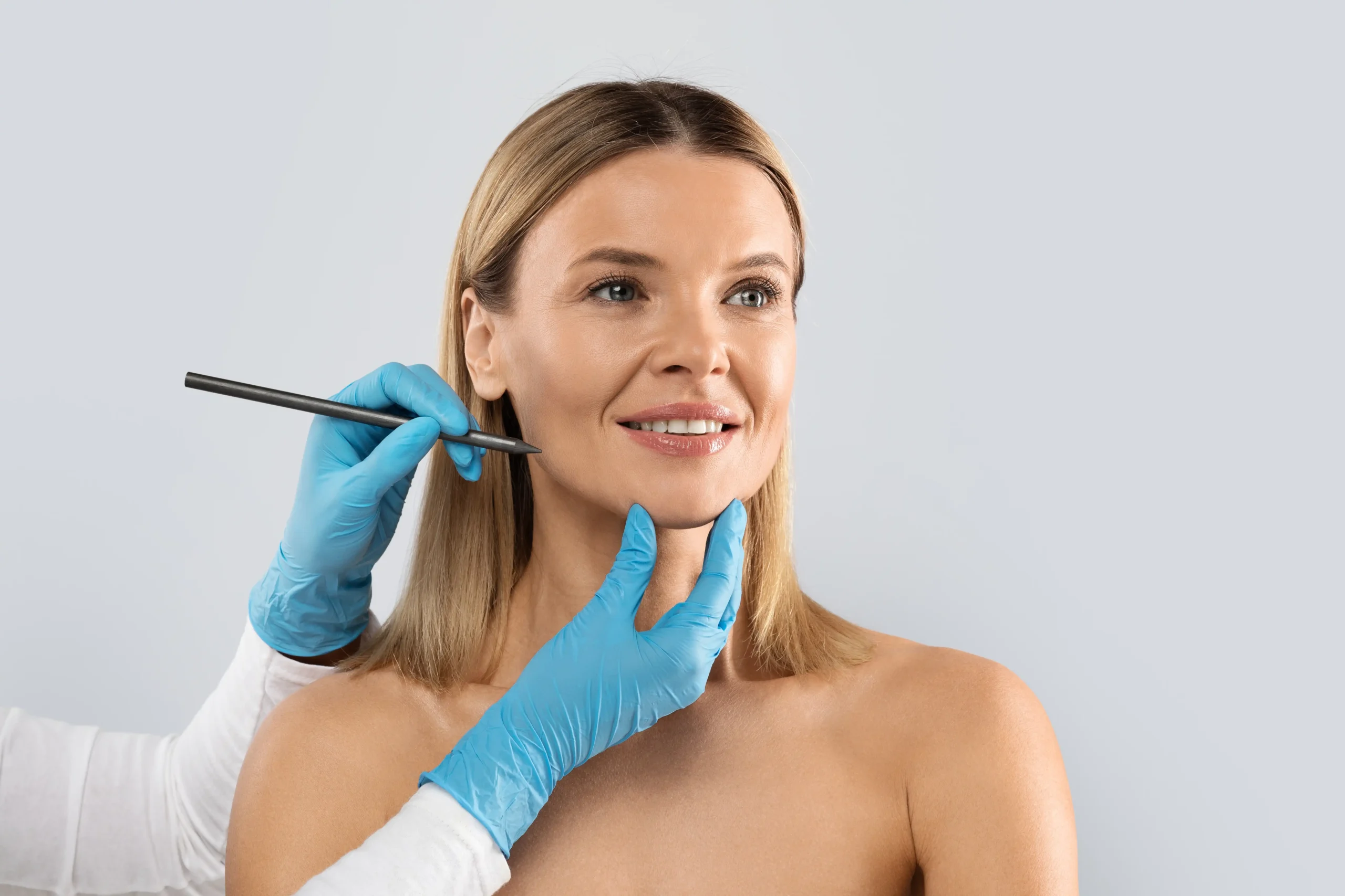 Facelift in Tijuana, Mexico 11 A professional plastic surgeon drawing surgical contours on a woman's face before a facelift in Tijuana, Mexico.