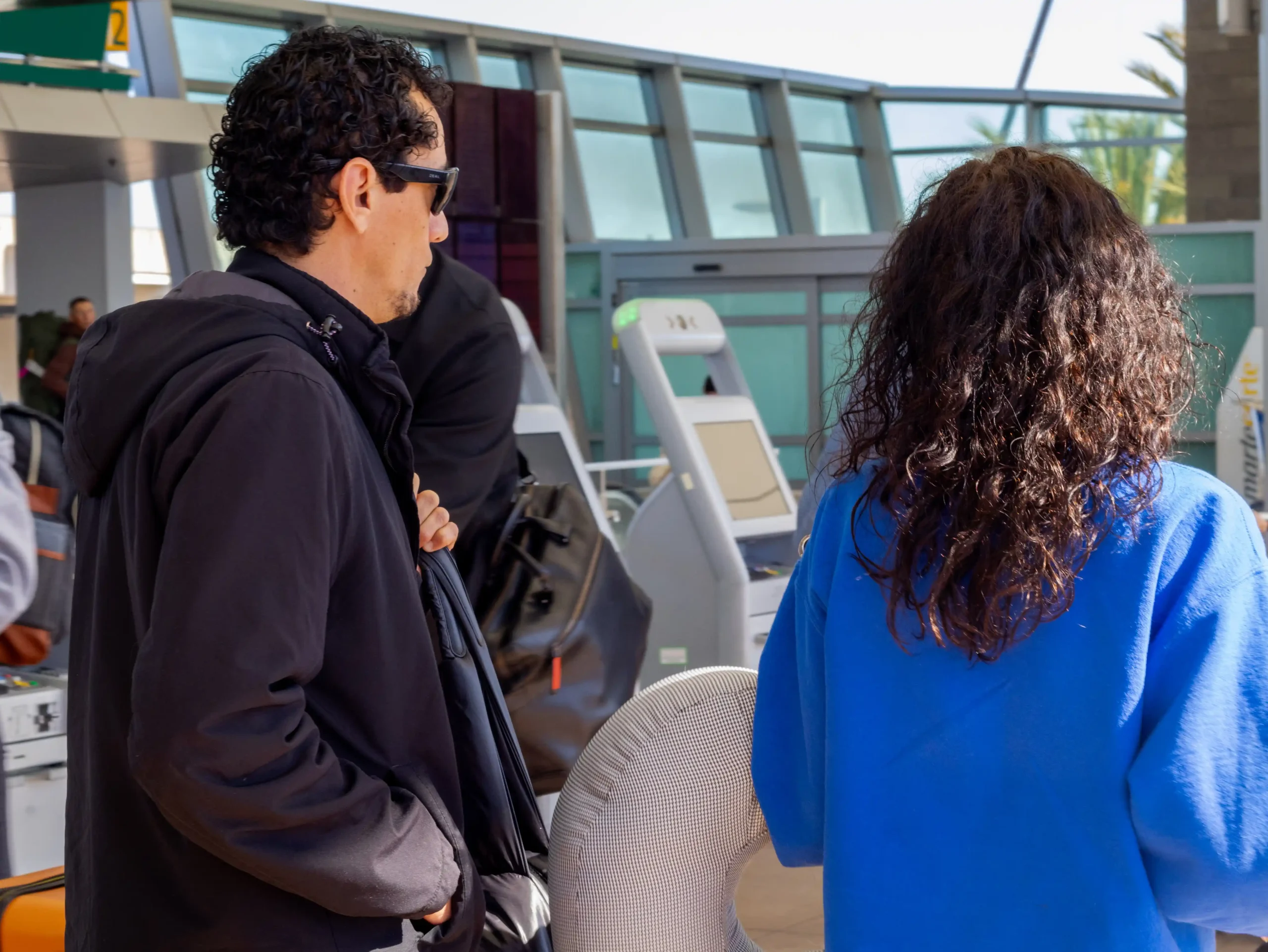 Patient Process 16 International patients with luggage at a San Diego terminal, starting their medical travel process for surgery in Mexico.