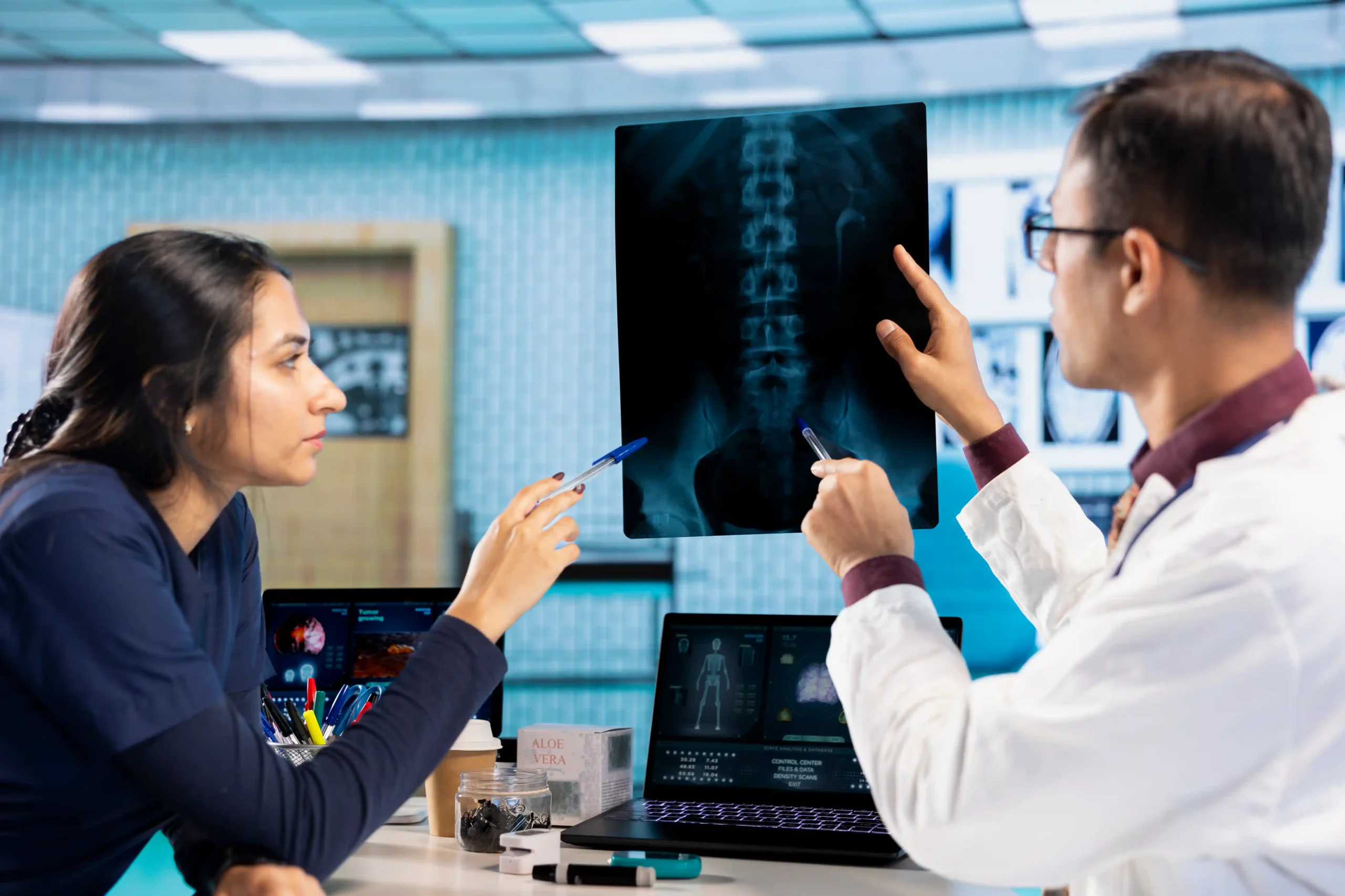 Artificial Disc Replacement in Tijuana, Mexico 17 Board-certified spine surgeons in Tijuana analyzing a spine X-ray for artificial disc replacement.